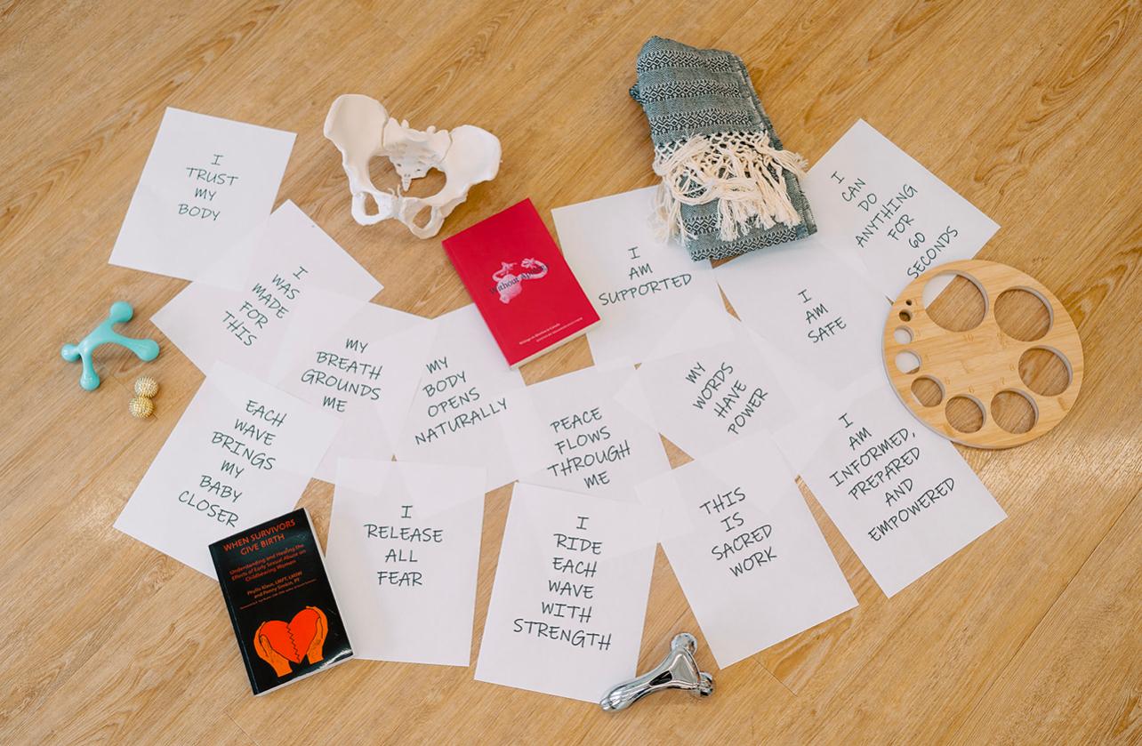 Birth affirmation cards and comfort tools laid out